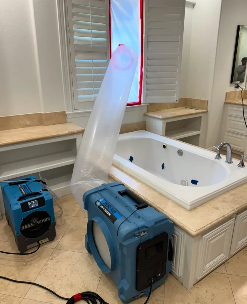 Air scrubber and dehumidifier equipment set up on a real Revive Pro Solutions job